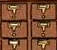 Close-up of several small, brown, wooden drawers with metal label holders and handles, typically found in a library card catalog.